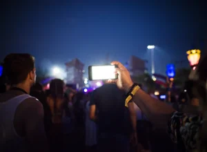 people-taking-photo-music-concert-festival